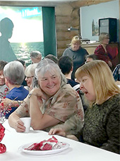 Marie-Paule (left) at an evangelistic Hope breakfast put on by their church
